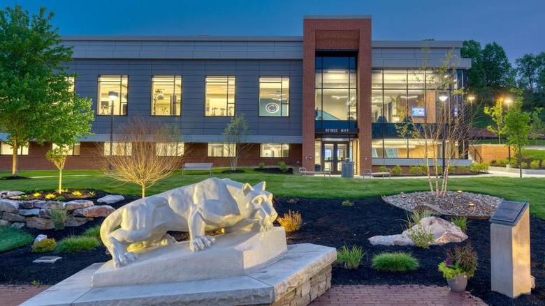 The Lion Shrine, in the foreground, on the Penn State DuBois campus outside the entrance of the PAW Center, which is visible in the background.